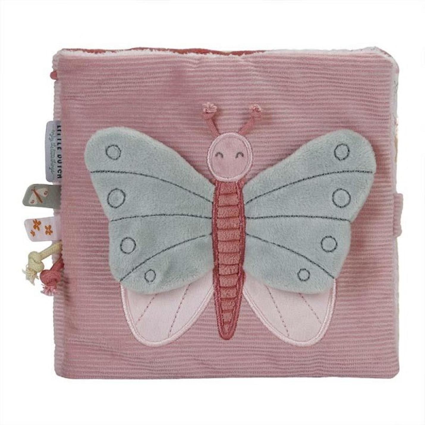 Activiteitenboekje flowers & butterfly's is roze van stof met aan de zijkant meerdere labels en voorop een grote grijs met roze vlinder