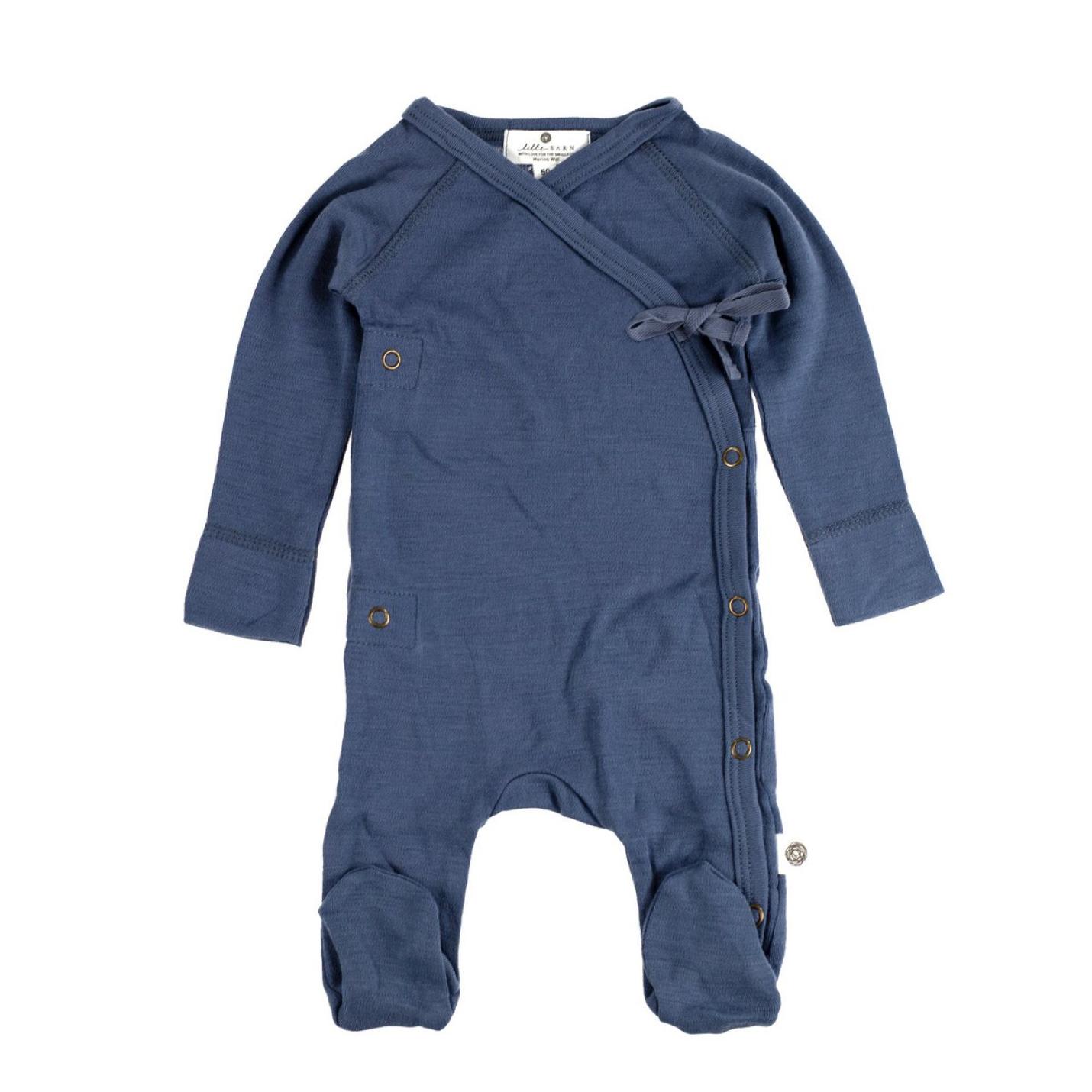 Boxpakje merino wol blauw is een boxpakje met voeten in de kleur blauw en een strik voorop links